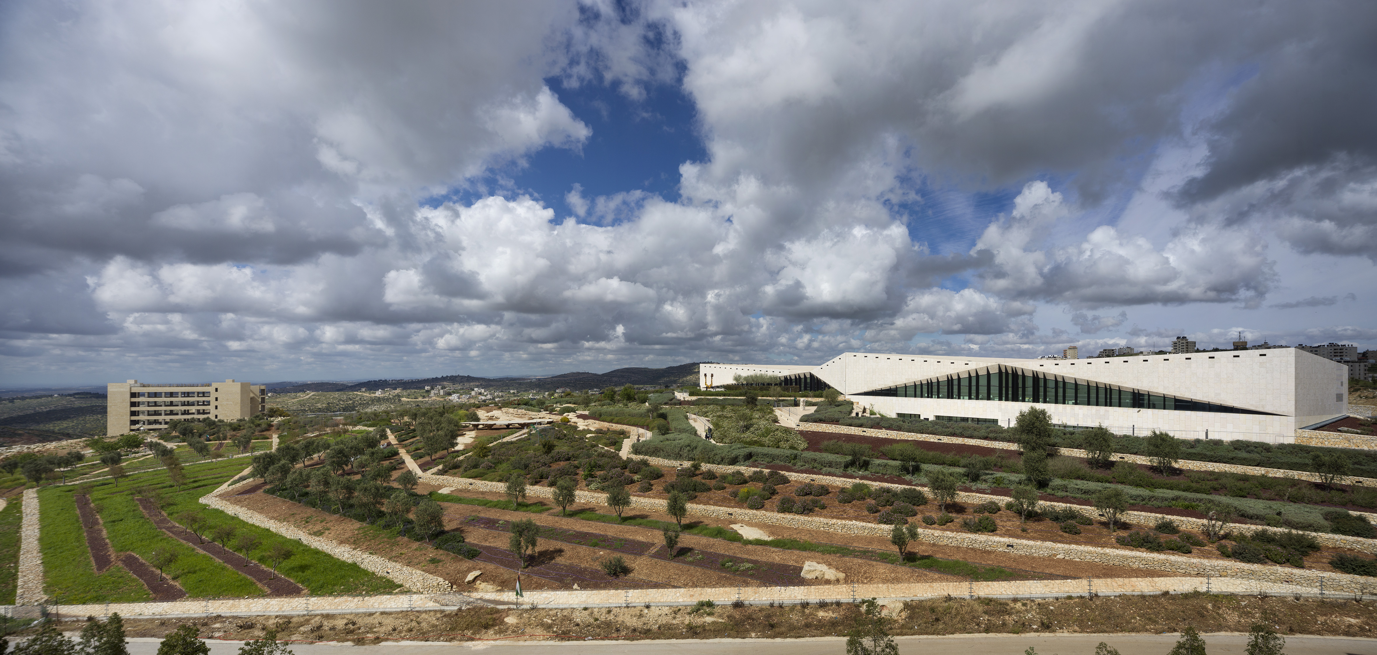 The Palestinian Museum’s design was inspired by the traditional terraced hills around Birzeit. It is surrounded by terraced gardens, planted with local trees and flowers.