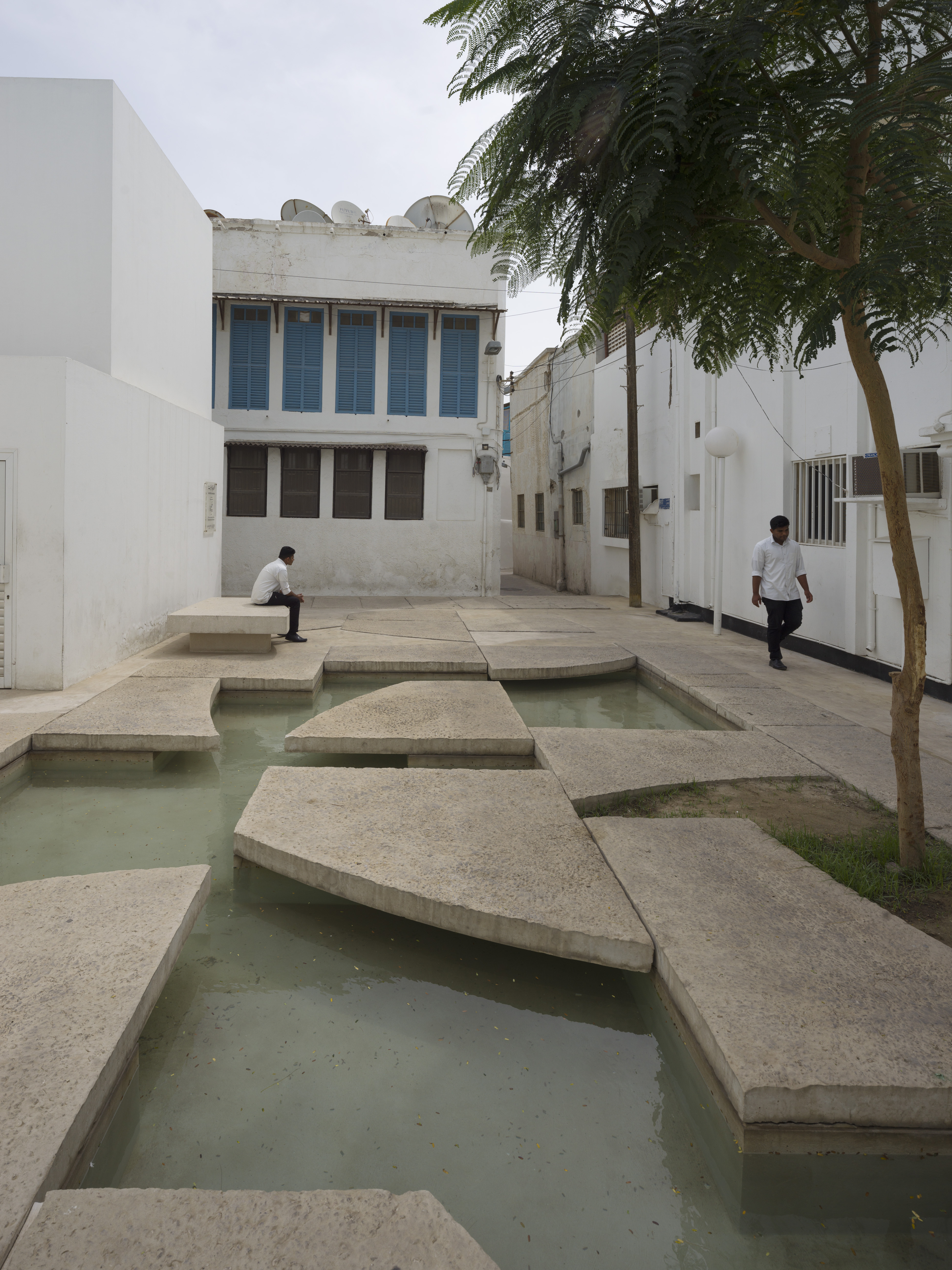 Shaded public space with water feature at the Shaikh Ebrahim bin Mohammed Al Khalifa Center for Culture &amp; Research
