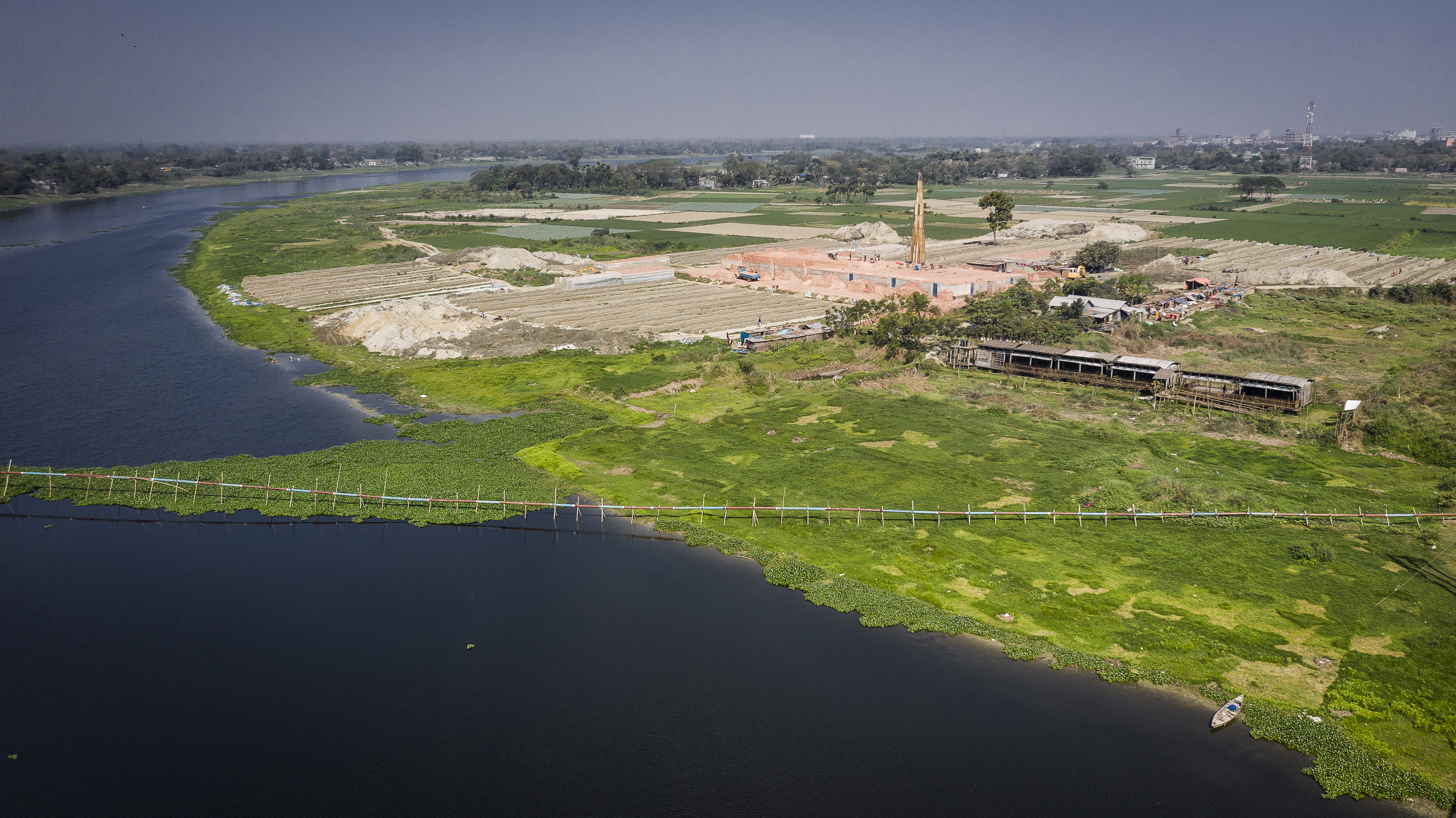 The school is built on a patch of land near a large river that overflows during the monsoon season