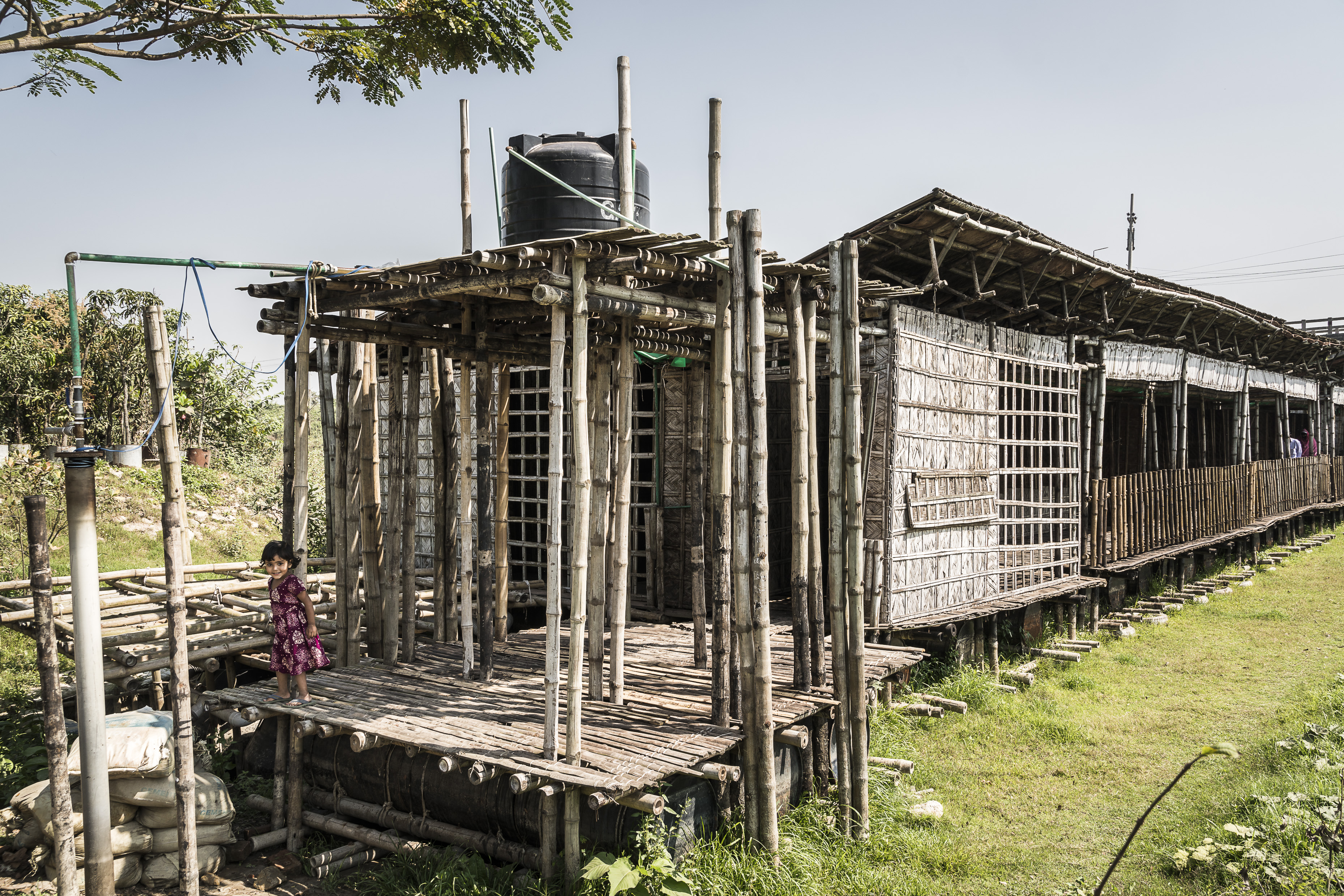The building is mainly made of bamboo, which is a traditional and very popular construction material in Bangladesh.