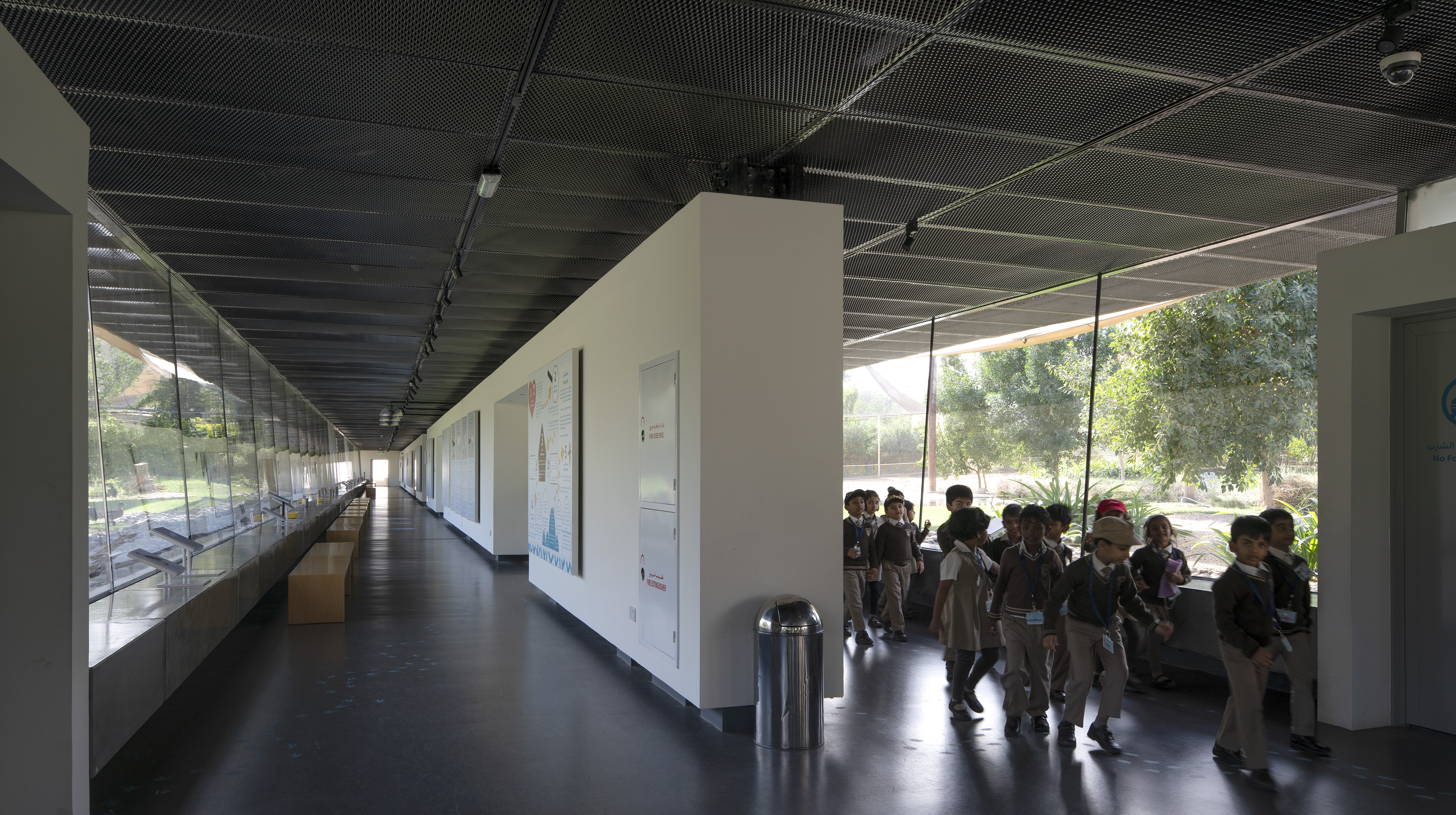 The dividing wall between the galleries hides all the services and provides surface for awareness and educational material.
