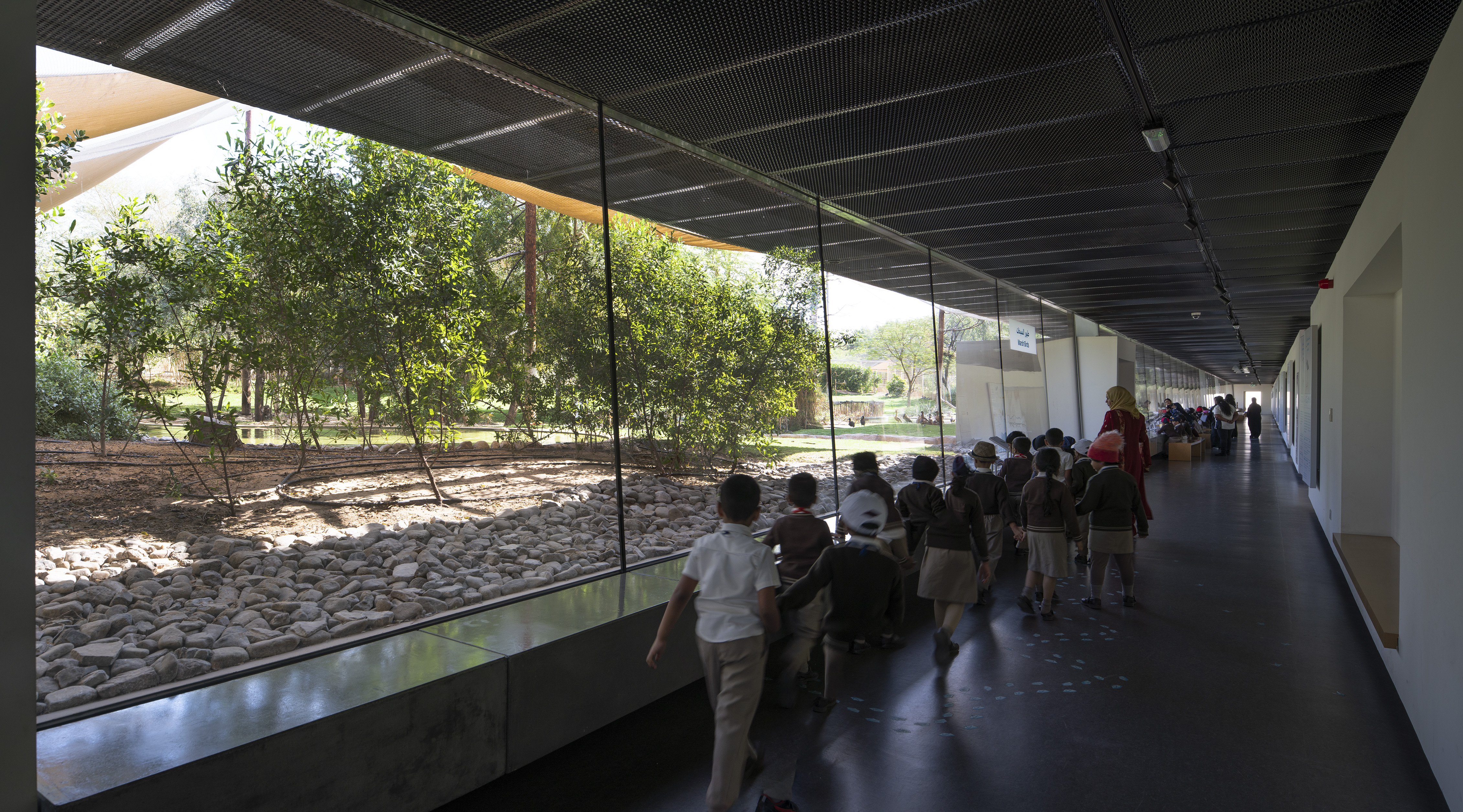 The gallery spaces are quite bare. They have an industrial feel owing to a dark metal mesh ceiling that lightly screens the steel structure and all services.