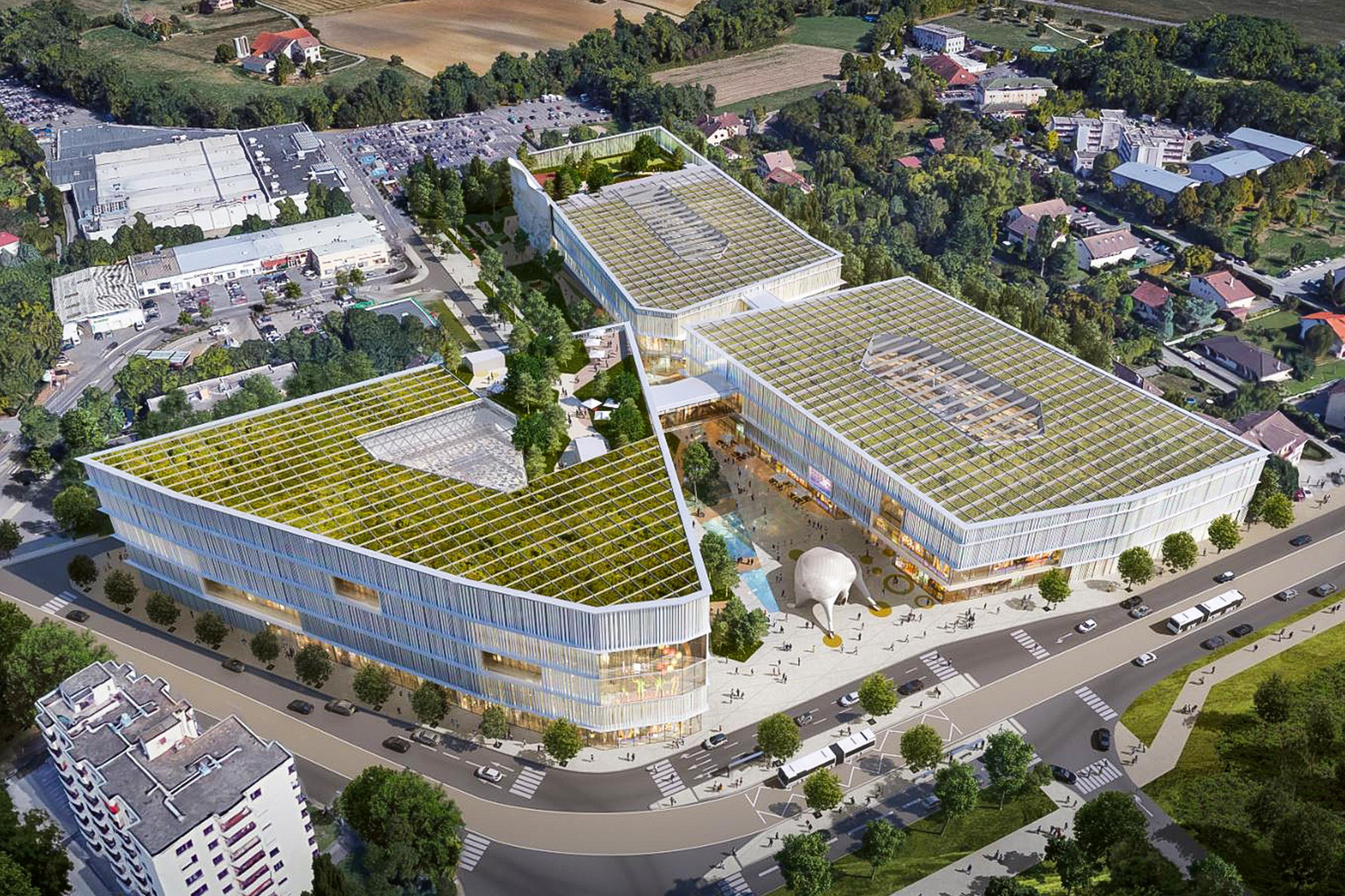 «Le projet imaginé par l’architecte Jean-Michel Wilmotte et le cabinet d’architecture Woods Bagot se composera de 3 bâtiments fortement inscrits dans leur environnement à travers des rotations tectoniques venant créer des structures en porte-à-faux qui empiètent sur la place centrale. Une façade conçue comme un rideau de scène et composée de colonnades en terre cuite émaillées, rappel de l’ancrage territorial local».