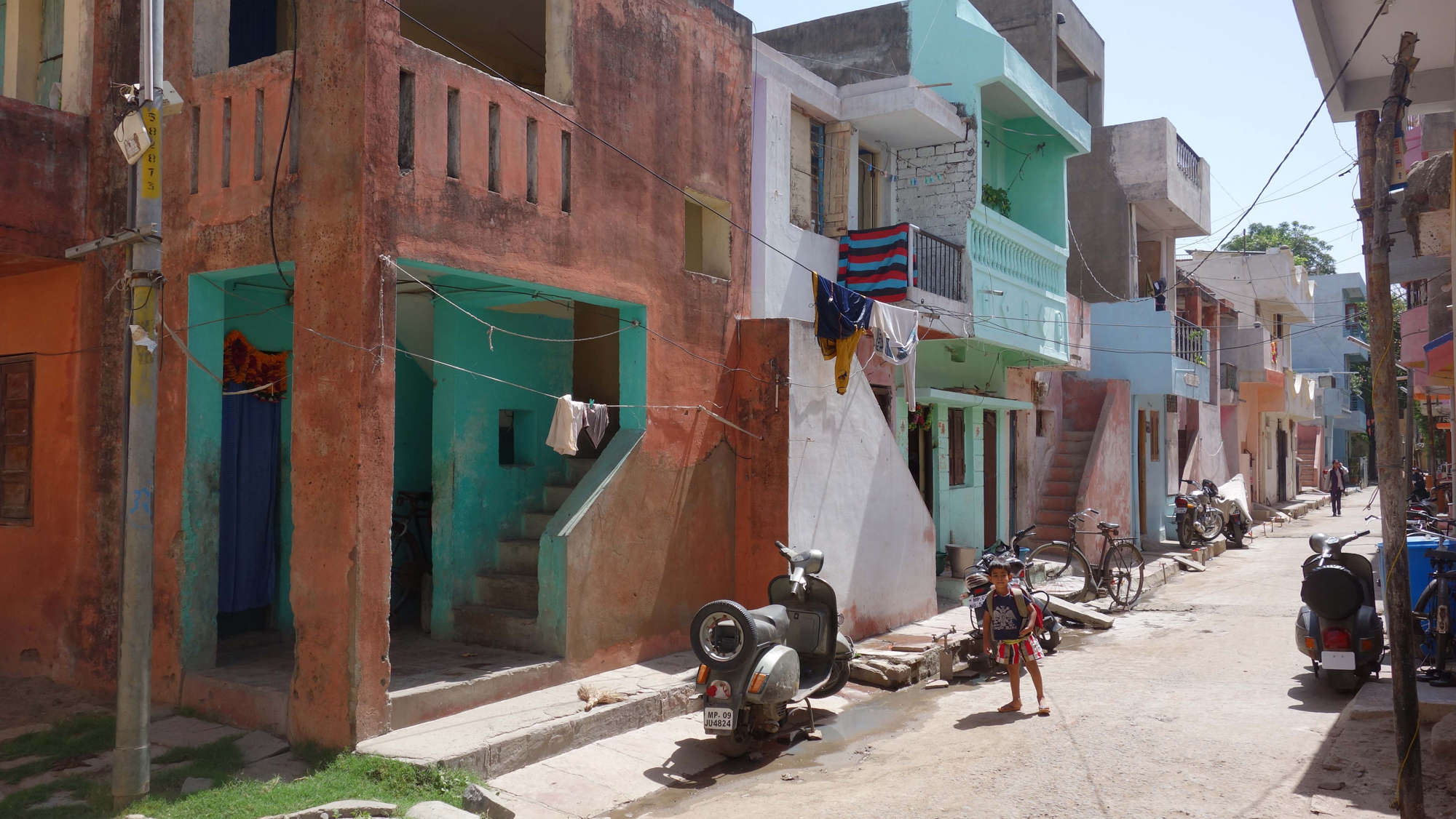 Streetview of social housing for various low income groups: »Aranya Low Cost Housing for Indore Development Authority«, Indore, 1989.