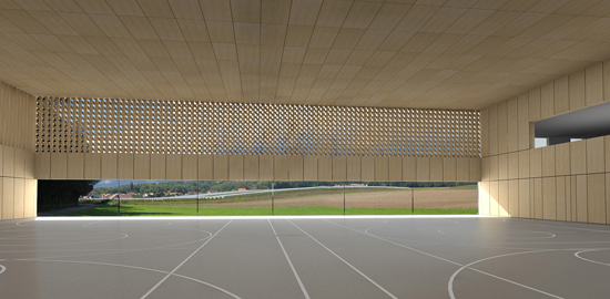 Das horizontal gestreckte Fenster der Doppelturnhalle in Borex-Crassier (Kanton Waadt) erzeugt zusammen mit dem hohen geschlossenen Sturz ein eindrückliches Landschaftspanorama. Architektur: Graeme Mann &amp; Patricia Capua Mann, Lausanne.