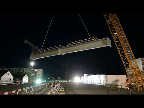 Preview image for the video "Baustelle Einhausung Schwamendingen – Einschwenken eines Deckenträgers ".